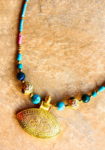 Turquoise necklace with eye shaped pendant